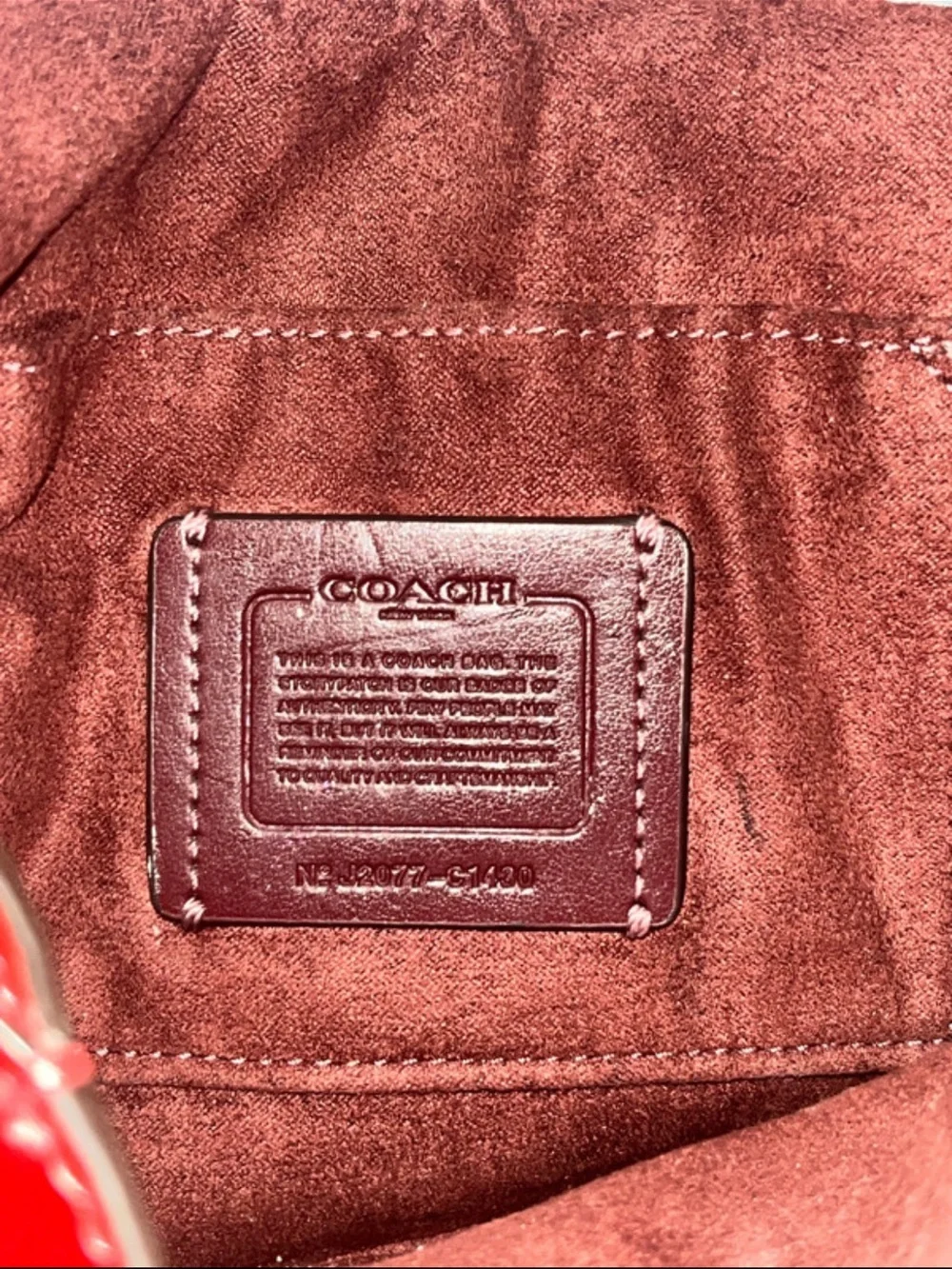 Coach Signature Canvas Saddle Crossbody Bag in Brown and Red